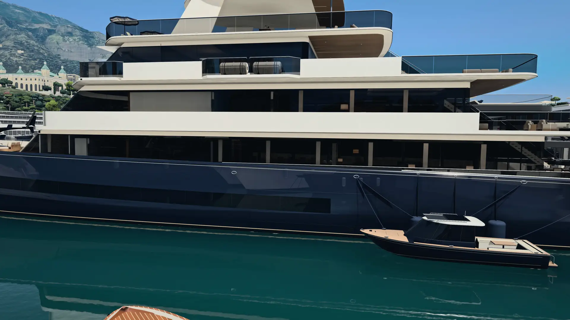 HALCYON VI, a 78-metre motor yacht, seen close from the water in Port Hercule, Monaco, by day: her white decks above a navy hull, a tender alongside, the Rock behind her.