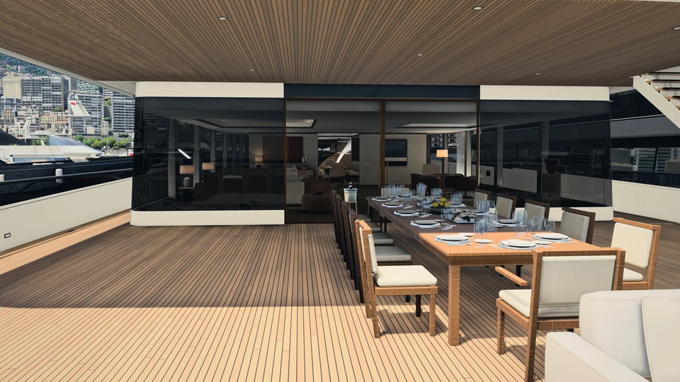 The aft deck of HALCYON VI by day: a long teak table laid with glasses and plates under the deckhead, the salon’s dark glass behind it, the town of Monaco beyond the rail.
