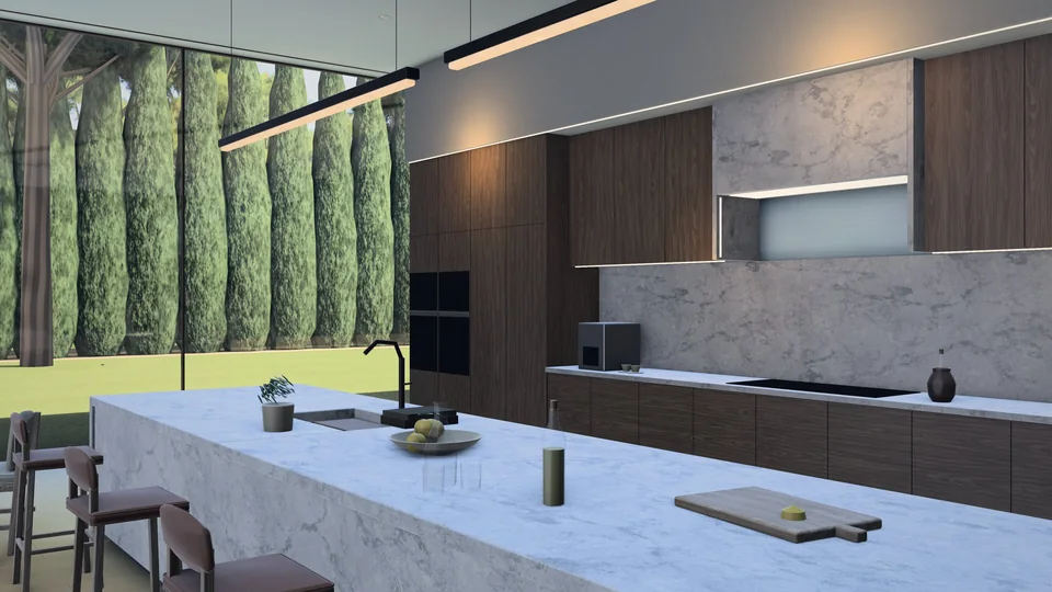 The kitchen of MIRALL: a long marble island with stools, walnut cabinets and a glass wall onto a row of cypresses.