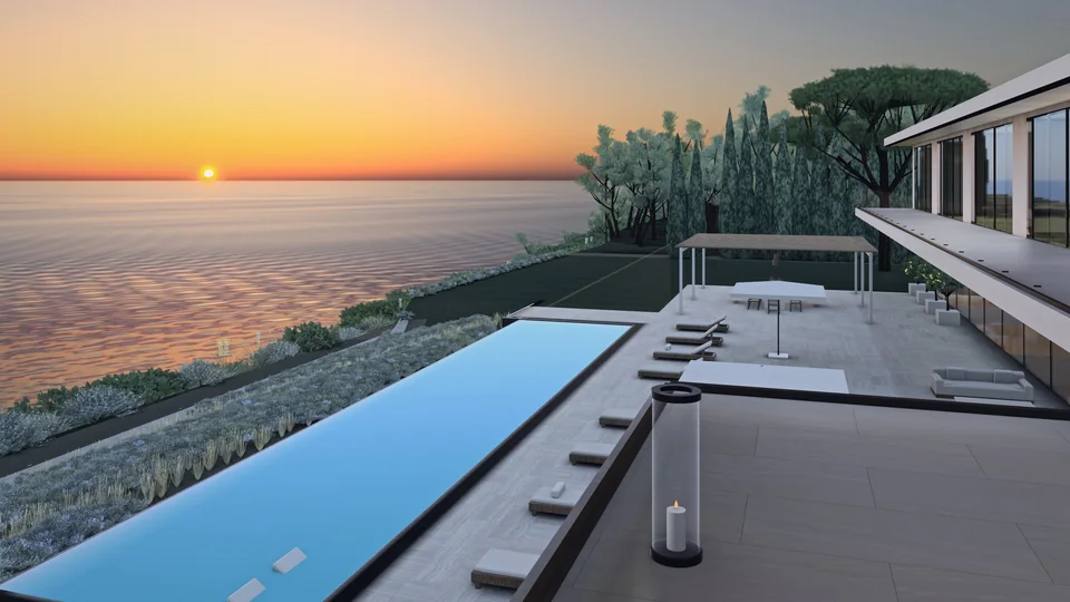 The sun setting over the sea beyond the long pool and the terrace of MIRALL, a lantern lit.